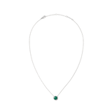 Delicate silver necklace with a round green malachite pendant, framed by small white zirconia stones, in a minimalist and elegant design.