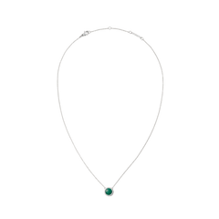 Delicate silver necklace with a round green malachite pendant, framed by small white zirconia stones, in a minimalist and elegant design.