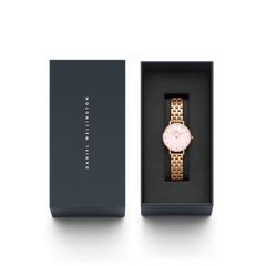 The Petite Lumine 5-Link Melrose ladies' watch in rose gold with a mother-of-pearl dial and crystal indices is elegantly presented in a premium Daniel Wellington gift box.