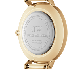 Back of the gold-coloured stainless steel case of the Petite St Mawes Gold ladies' watch with engraved Daniel Wellington logo and serial number.
