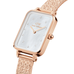 Close-up view of the Quadro Lumine Pressed Piano ladies' watch with a rectangular rose gold case, white mother-of-pearl dial, sparkling crystal indices and pressed piano link bracelet.