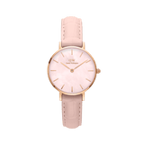 Elegant ladies' watch by Daniel Wellington with a rose gold case, delicate pink mother-of-pearl dial, and nude-pink leather strap with crocodile embossing.