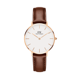Elegant women's watch with a slim rose gold case, white dial, and brown leather strap in a minimalist design.