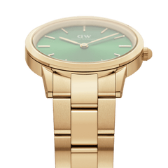 Detailed view of the Iconic Link Emerald Gold women's watch with gold-coloured stainless steel strap and green dial.